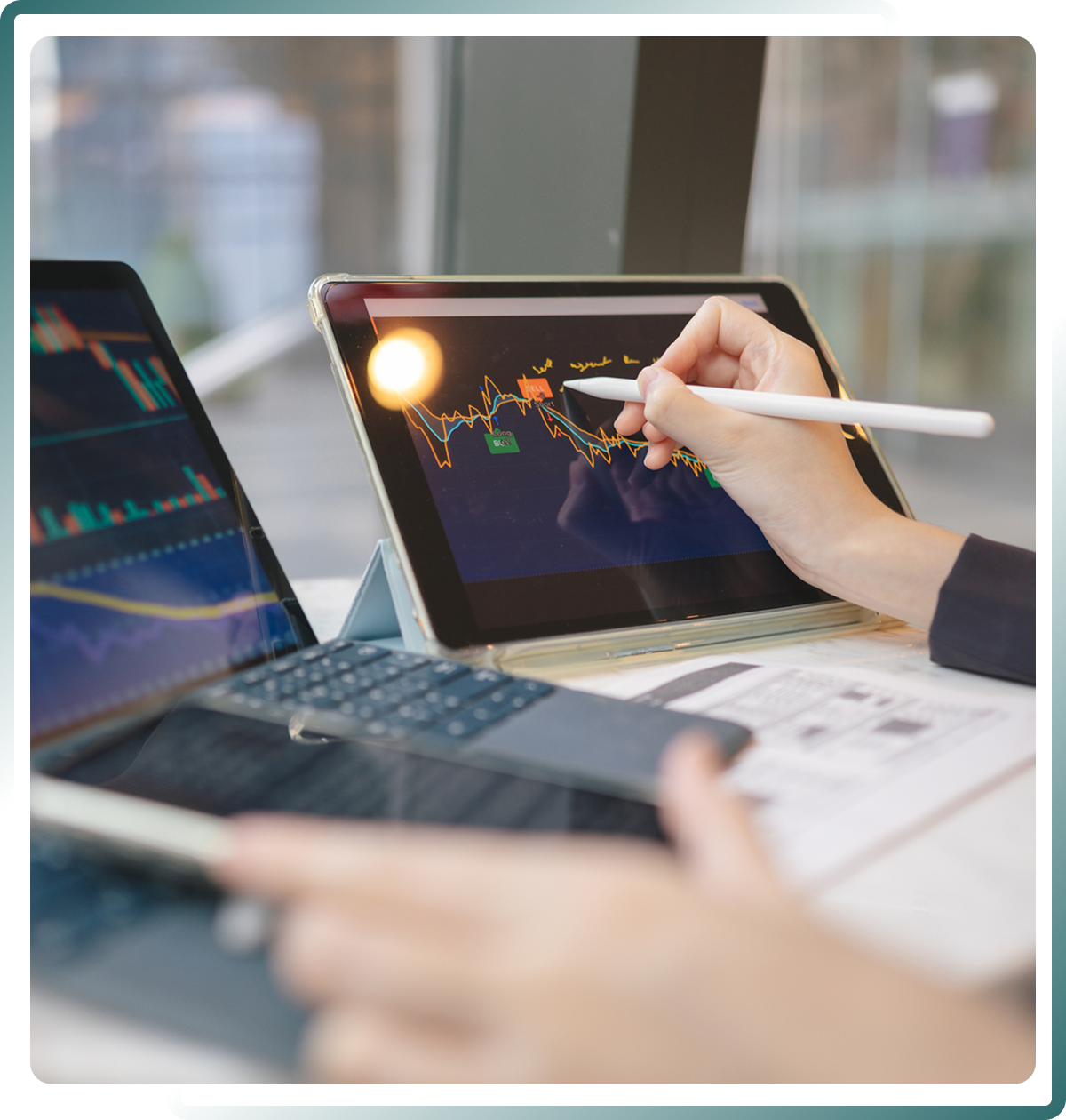 Person analyzing financial charts on tablet.