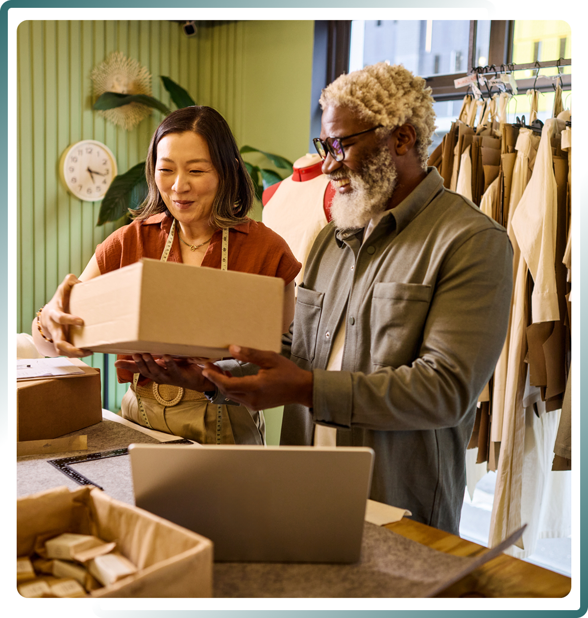 Two people handling a package together.