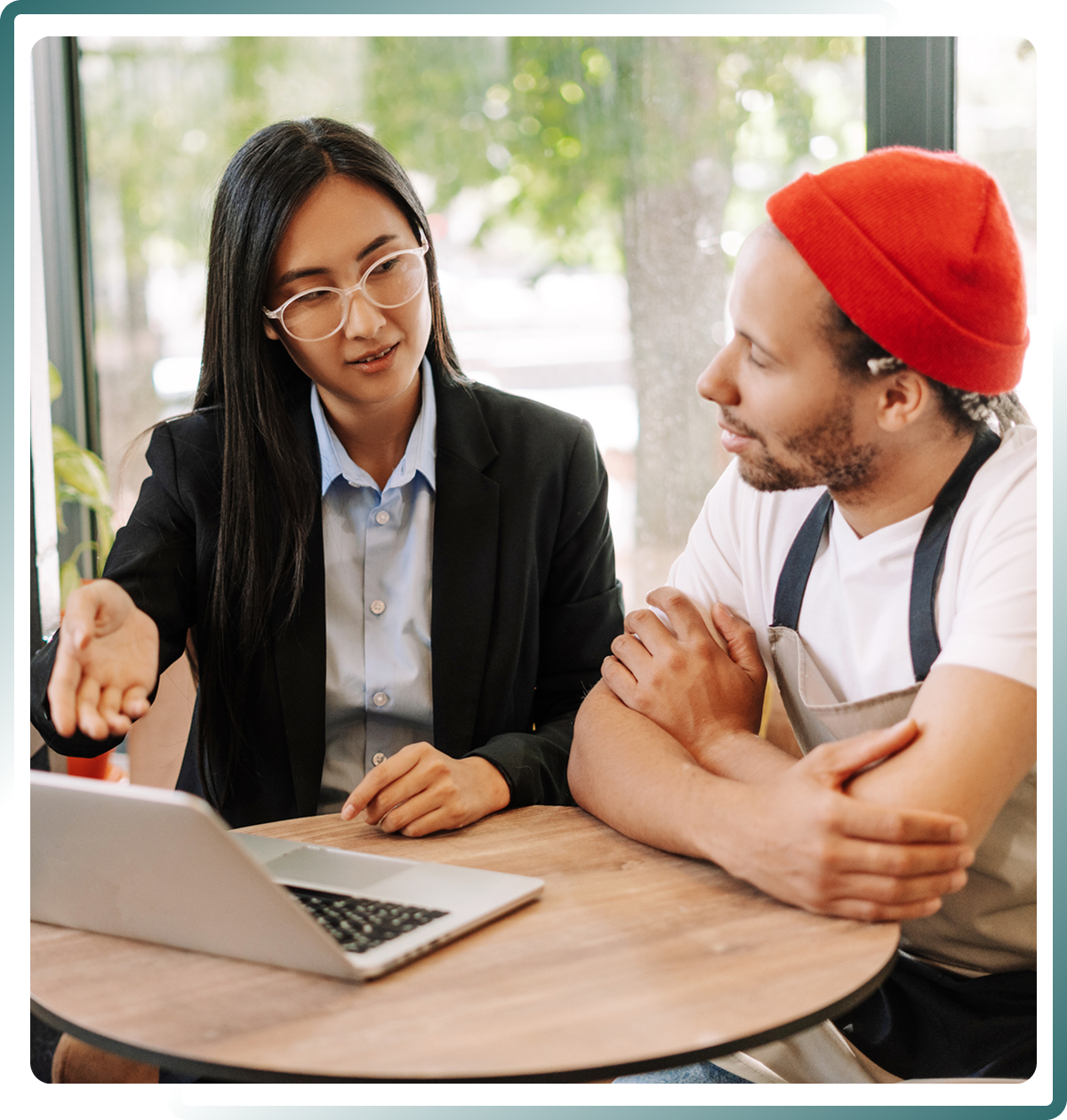 Person explaining something on a laptop.